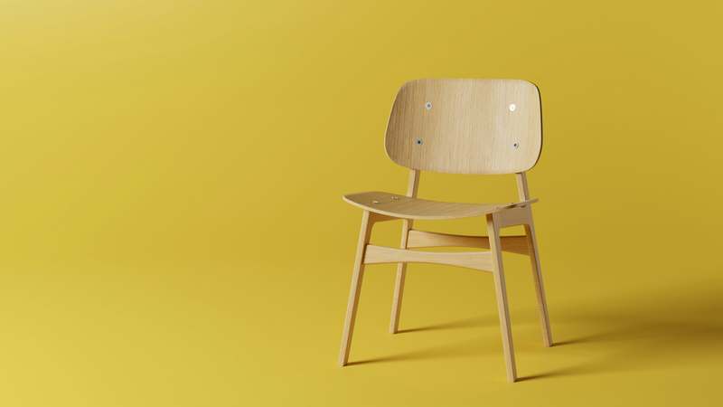 Compact folding dining table with chairs neatly tucked underneath in a compact urban apartment